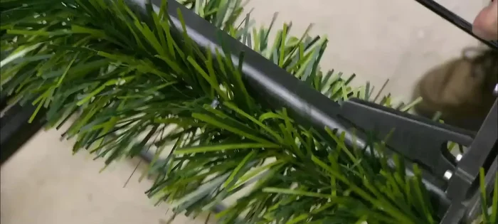 Install lights and ornaments: String the lights and wire the ornaments to the branches.