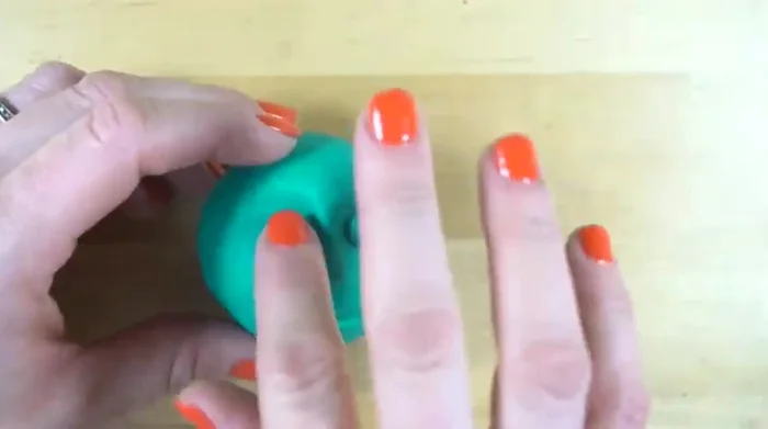 Add details like hair, eyes (using clay or pencil holes).