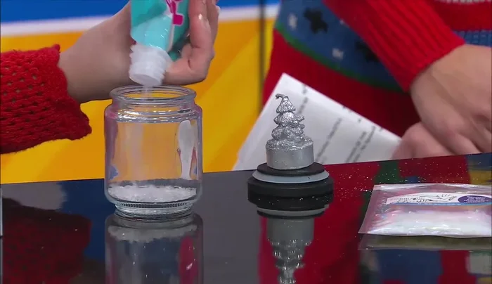 Fill with snow and glitter: Add poly pellets (artificial snow) and glitter to the jar.