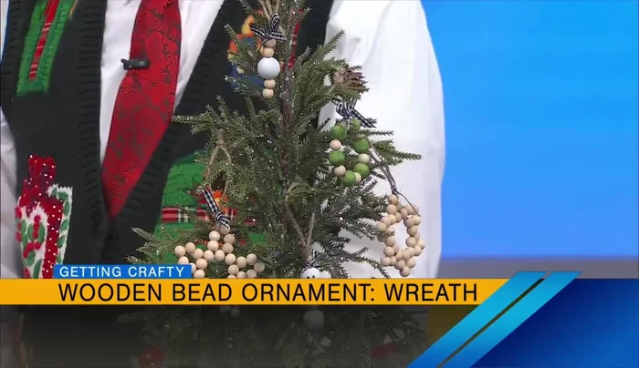 Make a snowman ornament: Paint three beads (different sizes optional) and string them onto jute. Add a face to the top bead.