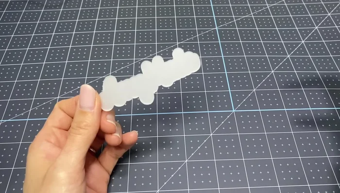 Measure and Resize Vinyl: Use a caliper to accurately measure the shrunk plastic and resize the vinyl design in Cricut Design Space to match.