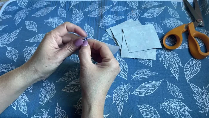 Peel and prepare the interfacing: Peel the paper backing from the Heat and Bond interfacing on all six pieces. If sticky residue remains, iron lightly.