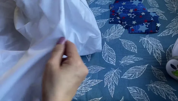 Attach to backing fabric: Place the six prepared fabric squares, interfacing side down, onto the wrong side of your backing fabric.