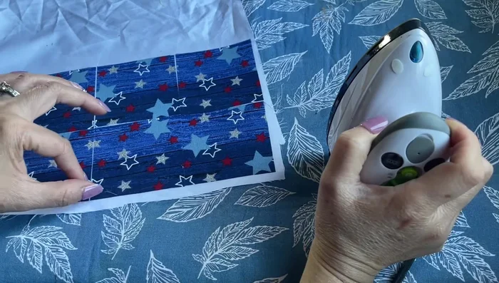 Cut and seal edges: Cut around the six squares, leaving a small seam allowance. To prevent fraying, apply clear nail polish to the edges or use a water bowl to keep the fabric from shifting while cutting.