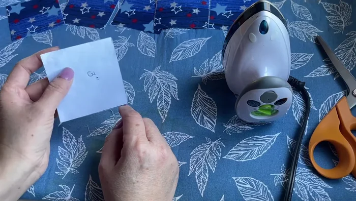 Fold each square: Fold each square in half, then in half again, creating a smaller square. Press the creases firmly.