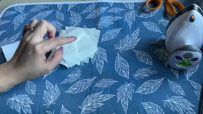 Prepare fabric squares: Cut six 3-inch square pieces of fabric from two different colors. Fuse Heat and Bond interfacing to the back of each fabric square using a medium-low iron setting.