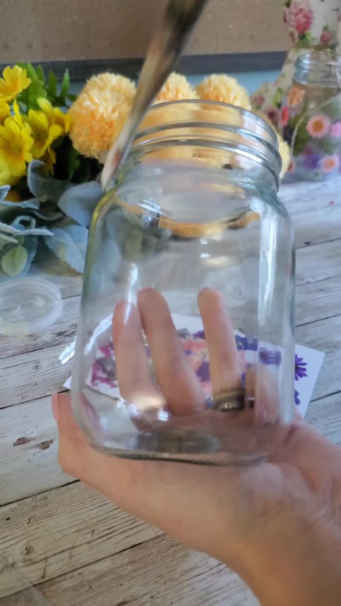 Paint a small area of the jar with Mod Podge.