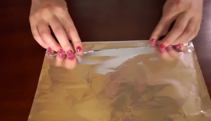Repeat the aluminum foil process with a smaller piece of foil.