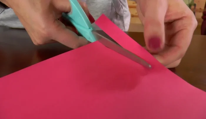 Apply a small amount of glue under the circles to secure the rice.