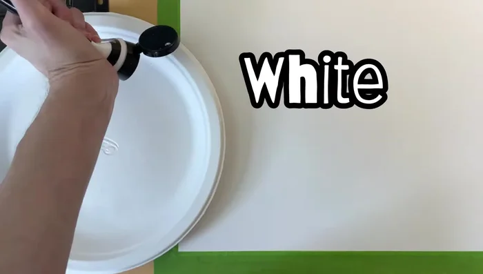 Mix light colors for your background using white, dark blue, dark green, light blue, yellow on a paper plate.