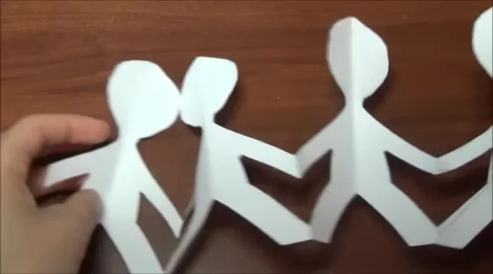 Open up the paper to reveal your finished family craft.