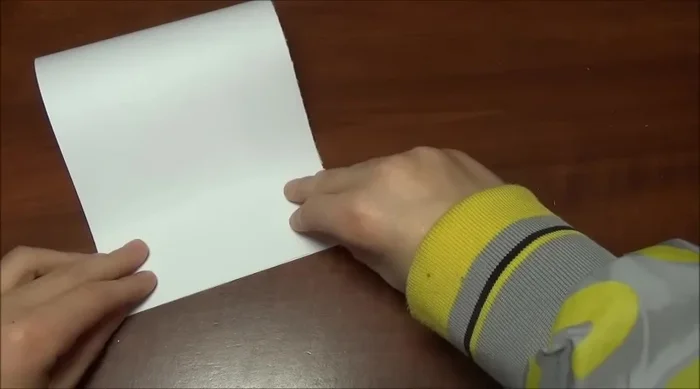 Fold the other half in half, ensuring a clean finish.