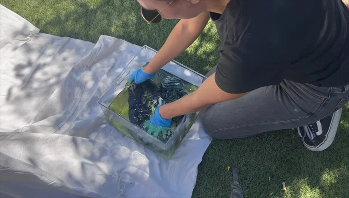 Rinse and wash. Remove the design, and immediately rinse the fabric in cold water with hydrogen peroxide to stop the reaction.