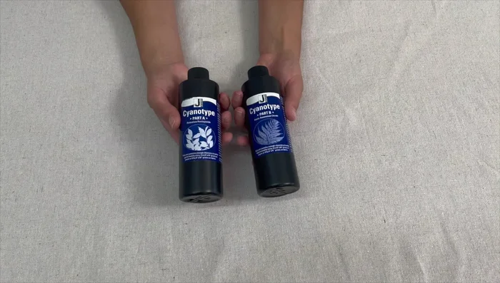 Mix the cyanotype solution. In a dark room, mix equal parts of solution A and B from the kit.