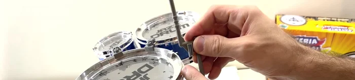 Attach the last piece into the small hole at the top, joining it to the edge of the drum.