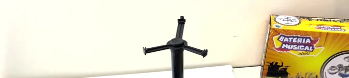 Place the drum onto the assembled legs, ensuring the top part with the hole is facing up.