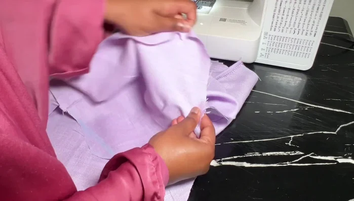 Attach sleeves: Match center to center, pin, sew, and trim excess fabric.