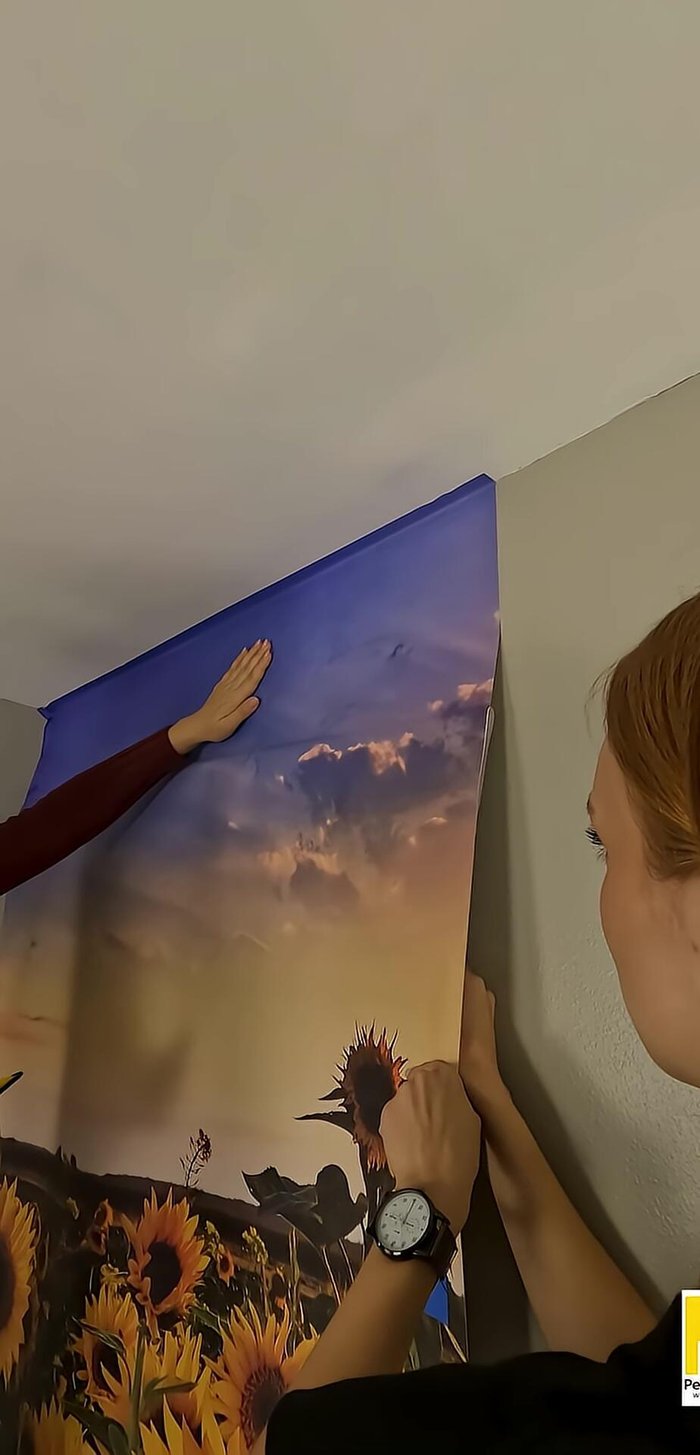 Smooth the panel from the middle outward, working in 10-inch sections. Continue until the whole panel is adhered.