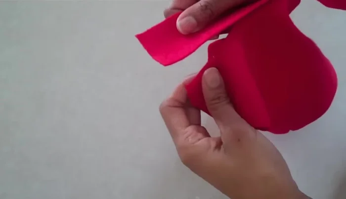 Optionally, add a collar by cutting a felt strip, placing it inside the neckline, sewing it in place, and flipping it over.