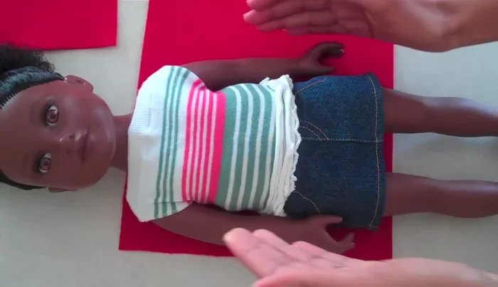 Cut a small semicircle around the notch for the neck opening.