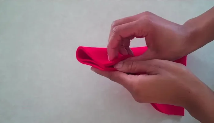 Cut a small semicircle around the notch for the neck opening.