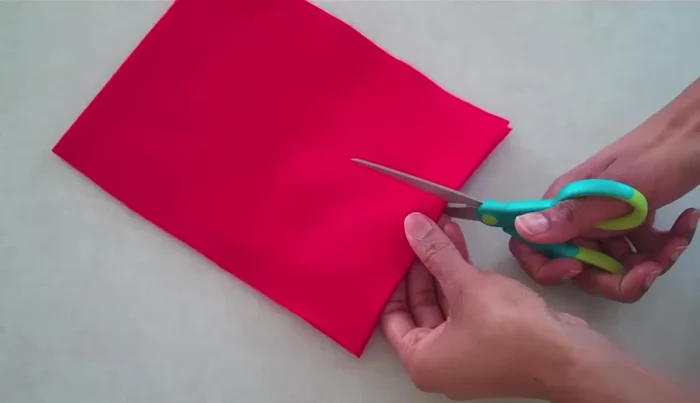 Cut a small semicircle around the notch for the neck opening.