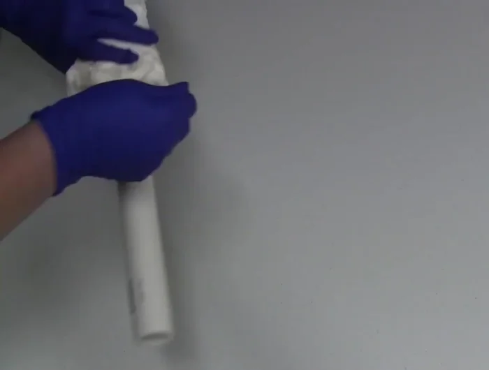 Tie the shirt tightly with kite string, bunching it further to create more wrinkles.