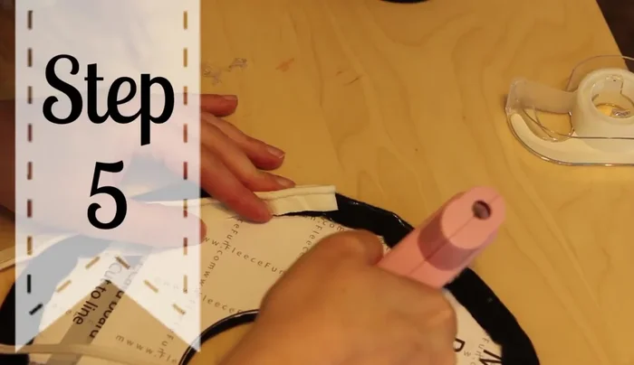 Glue the smaller brim piece onto its cardstock base, ensuring the edges are well-glued.