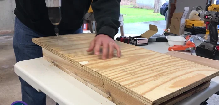 Attach the roof using a good amount of caulk, ensuring angles align for proper downward slope.