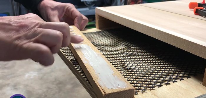 Sand the entire project and paint it black.