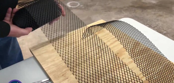 Attach the mesh to one side of the plywood using a staple gun.