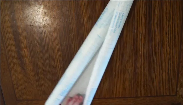 Seal with second layer: Cut a second piece of contact paper to the same size. Carefully place it sticky side down over the tissue paper, smoothing out any air bubbles.