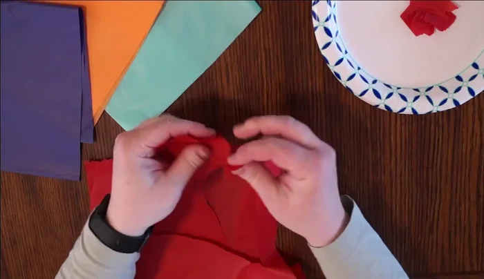 Prepare tissue paper: Rip or cut tissue paper into small pieces. Mix the colors.