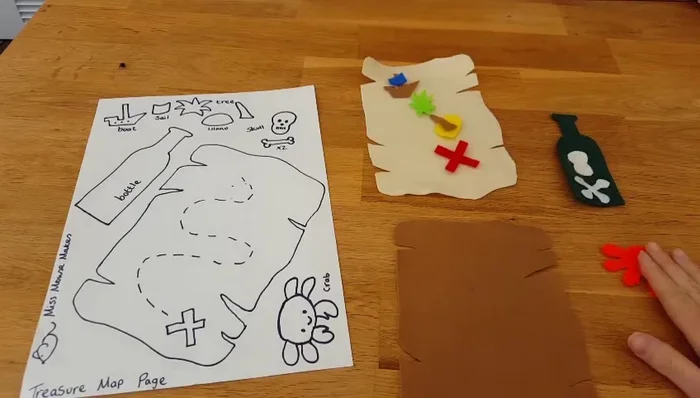 Prepare your felt pieces according to the template. Arrange them as desired on your cream/beige felt base.