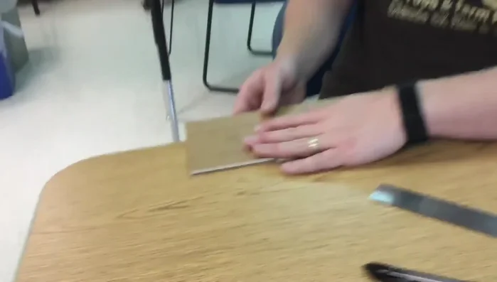 Using your fingernail, carefully tear away the 3/16 inch section of foam between the cuts, leaving the bottom paper intact.