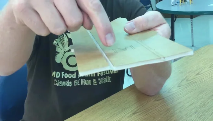 Fold the foam board to create either an 'A' fold (side plate above the bottom plate) or a 'B' fold (side plate beside the bottom plate), depending on your project's needs.