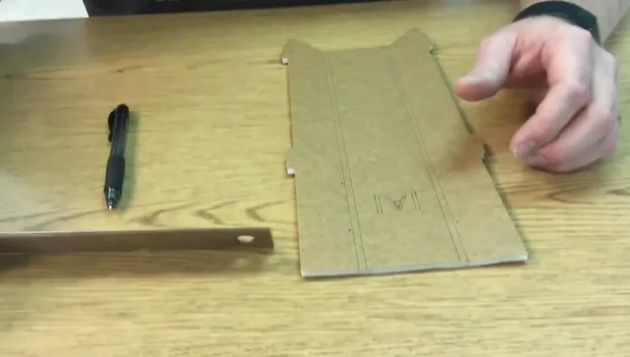 Using a straight edge, connect the marks to create a straight cutting line.