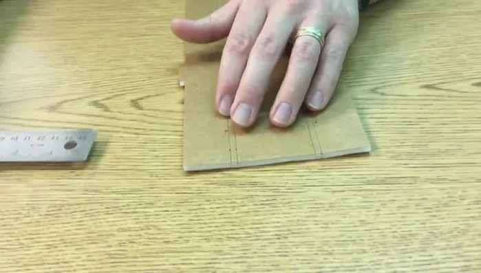 Using a straight edge, connect the marks to create a straight cutting line.