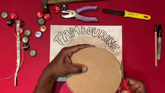 Punch holes using a heavy-duty hole punch.