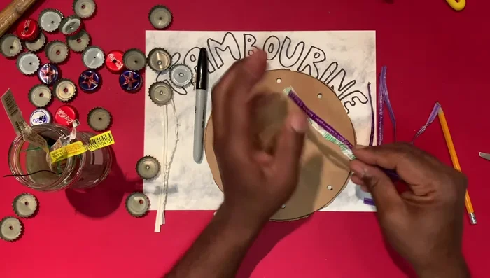 Attach two bottle caps back-to-back using twisty ties to create jingles.