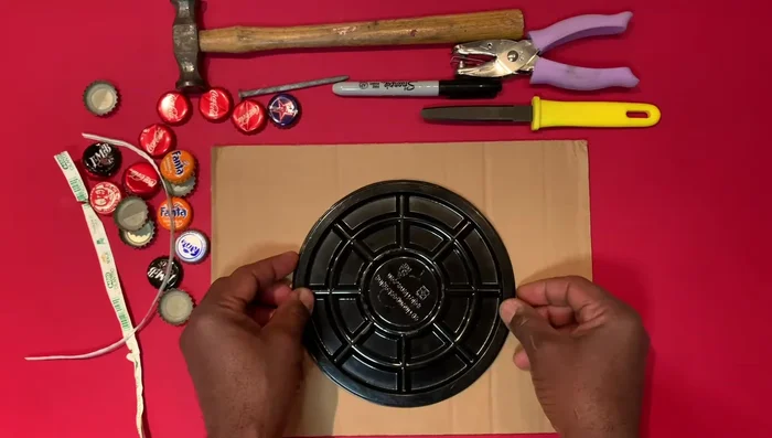 Cut a circle from cardboard using a rotary cutter.