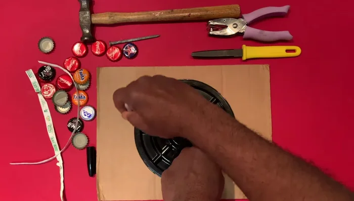 Cut a circle from cardboard using a rotary cutter.