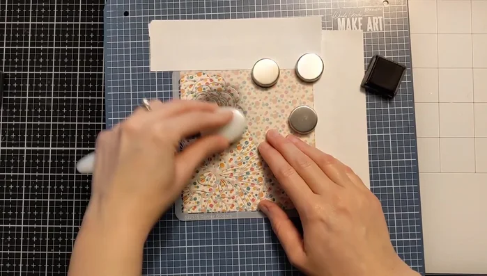 Remove the stencil and Post-it tape to reveal the embossed design.