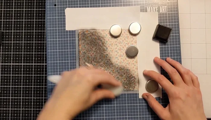 Remove the stencil and Post-it tape to reveal the embossed design.