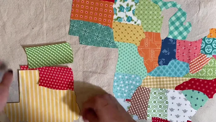 Use charm packs or fabric scraps for the states (consider size).