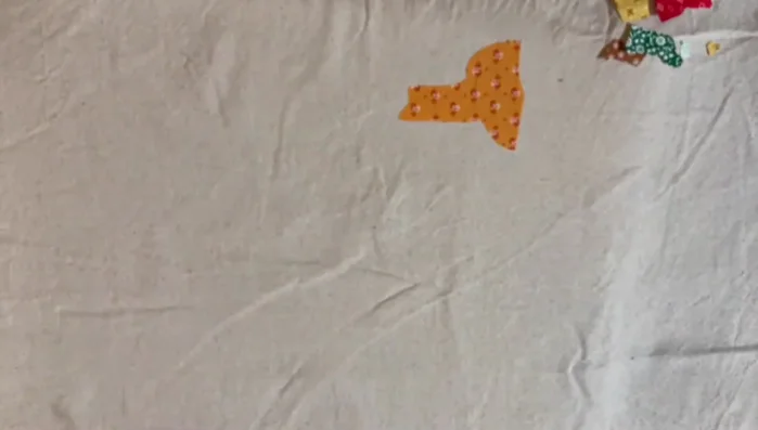 Remove backing from remaining states, aligning and ironing in sections.