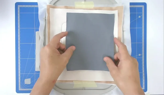 Place and tape the animal fabric, stitch it down (number six).