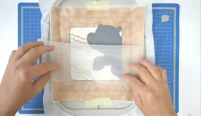 Place, tape, and stitch the organza (number ten).