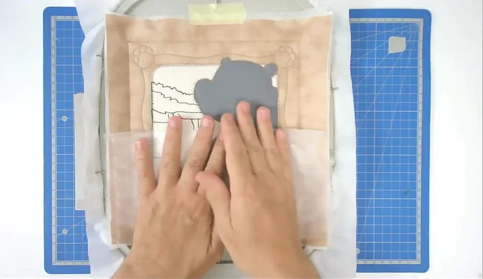 Fold back and tape the organza, stitch to secure (number eleven).