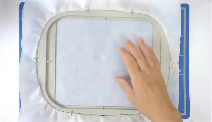 Hoop the stabilizer (cutaway for in-the-hoop, wash-away for appliqué).